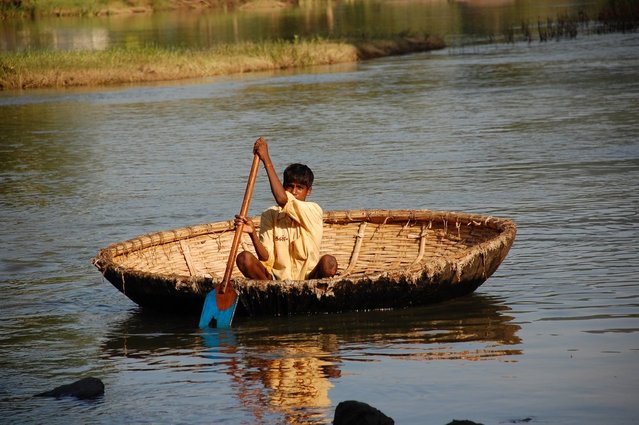 The Boatmen by Ned Marcus—image of a coracle in India.